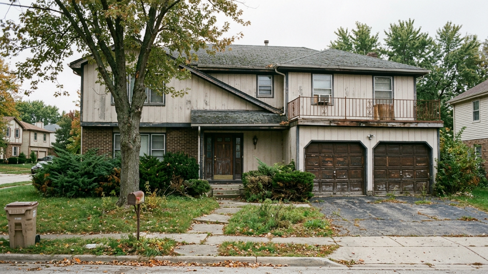 Old outdated Wyoming house exterior ready for sale and renovation